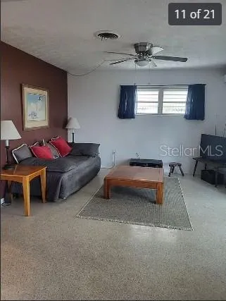 a bedroom with furniture and a lamp