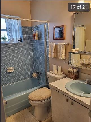 158 Concord Drive Northeast Port Charlotte, FL 33952 - Photo 17 of 21 a bathroom with a sink a toilet and shower