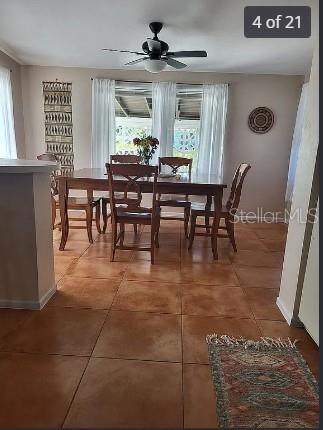 158 Concord Drive Northeast Port Charlotte, FL 33952 - Photo 4 of 21 a view of a dining room with furniture and window