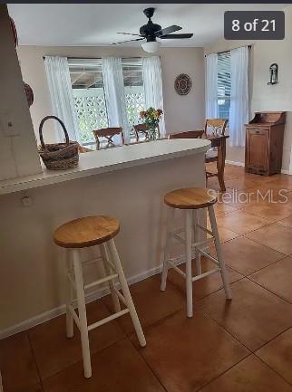 158 Concord Drive Northeast Port Charlotte, FL 33952 - Photo 8 of 21 a room with gym equipment and a table