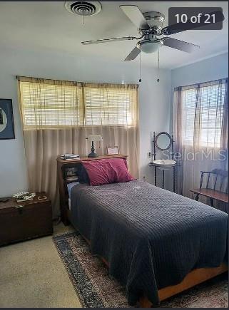 158 Concord Drive Northeast Port Charlotte, FL 33952 - Photo 10 of 21 a bedroom with a bed and window