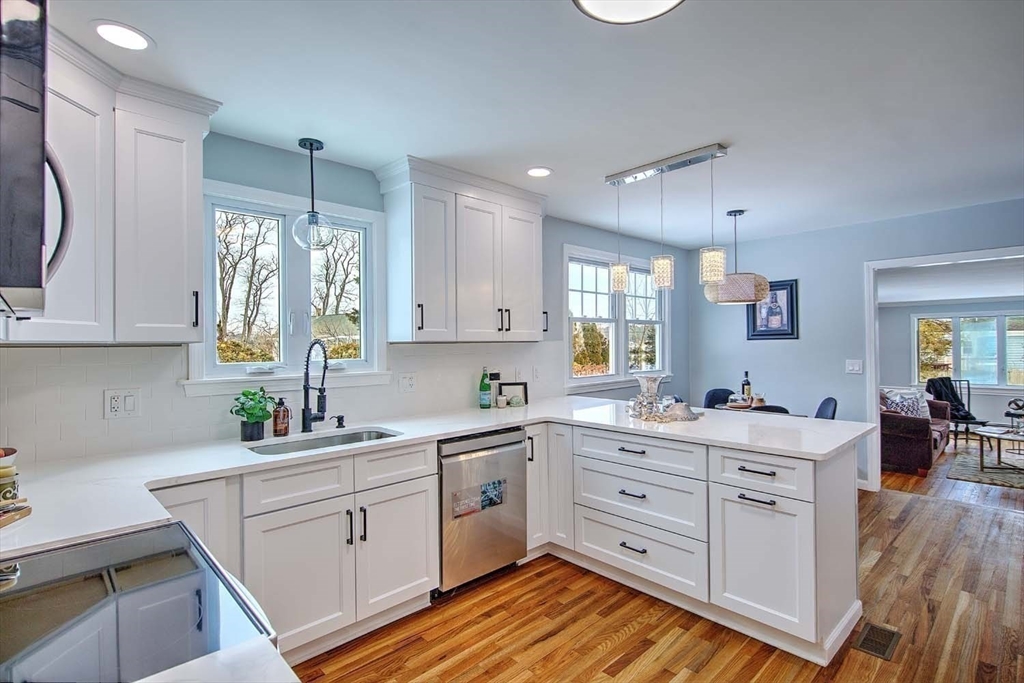 3 Pinetop Road Barrington, RI 02806 - Photo 12 of 38 a kitchen with white cabinets and sink