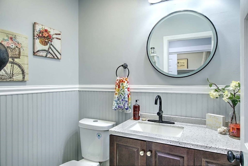3 Pinetop Road Barrington, RI 02806 - Photo 20 of 38 a bathroom with a sink a mirror and a toilet