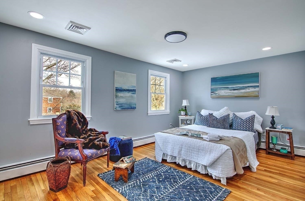 3 Pinetop Road Barrington, RI 02806 - Photo 22 of 38 a bedroom with a bed and wooden floor