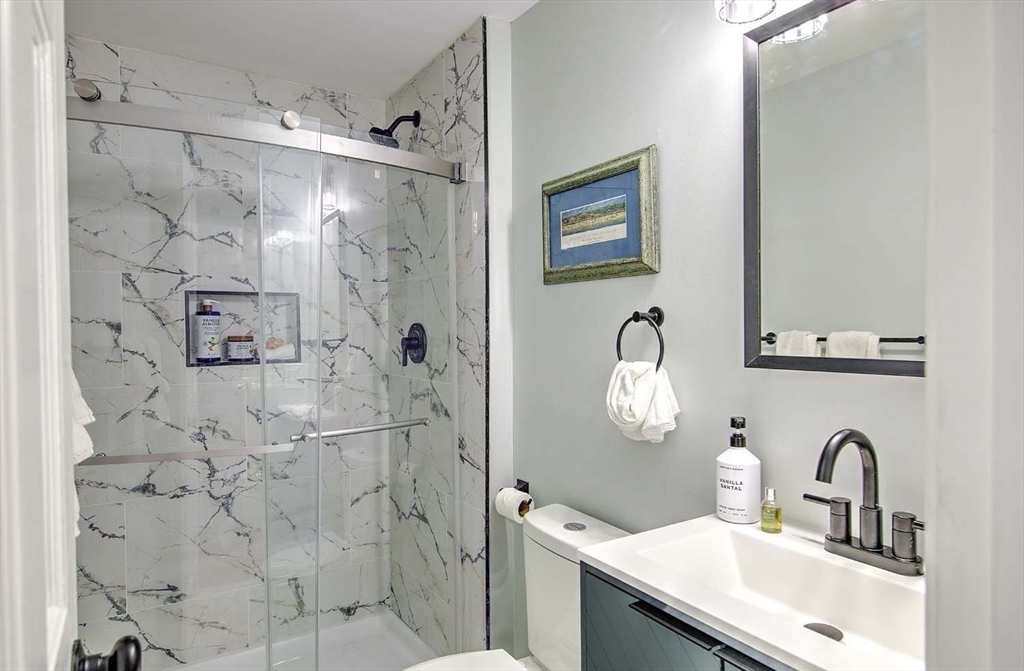 3 Pinetop Road Barrington, RI 02806 - Photo 24 of 38 a bathroom with a sink vanity mirror and shower