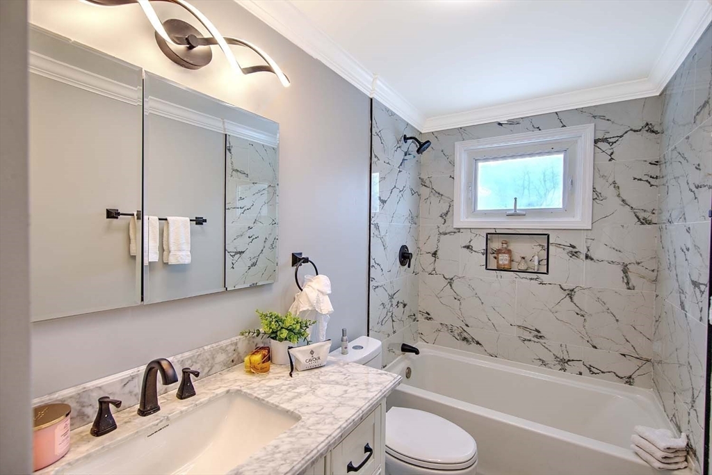3 Pinetop Road Barrington, RI 02806 - Photo 26 of 38 a bathroom with a granite countertop sink a toilet and bathtub