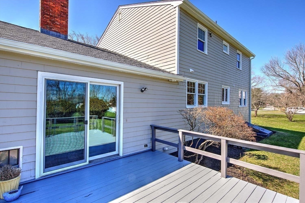 3 Pinetop Road Barrington, RI 02806 - Photo 31 of 38 a view of a roof deck with wooden floor and fence