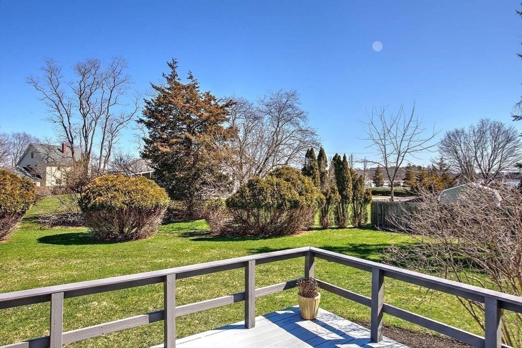 3 Pinetop Road Barrington, RI 02806 - Photo 32 of 38 a view of a wooden deck and a yard