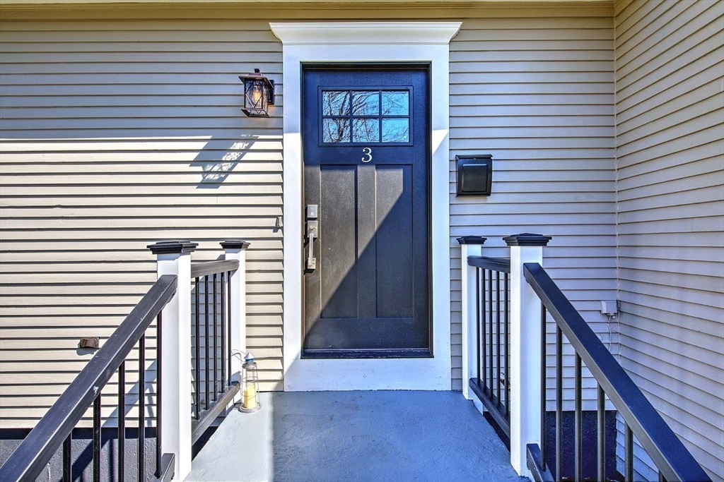 3 Pinetop Road Barrington, RI 02806 - Photo 5 of 38 a view of a balcony with wooden floor and stairs