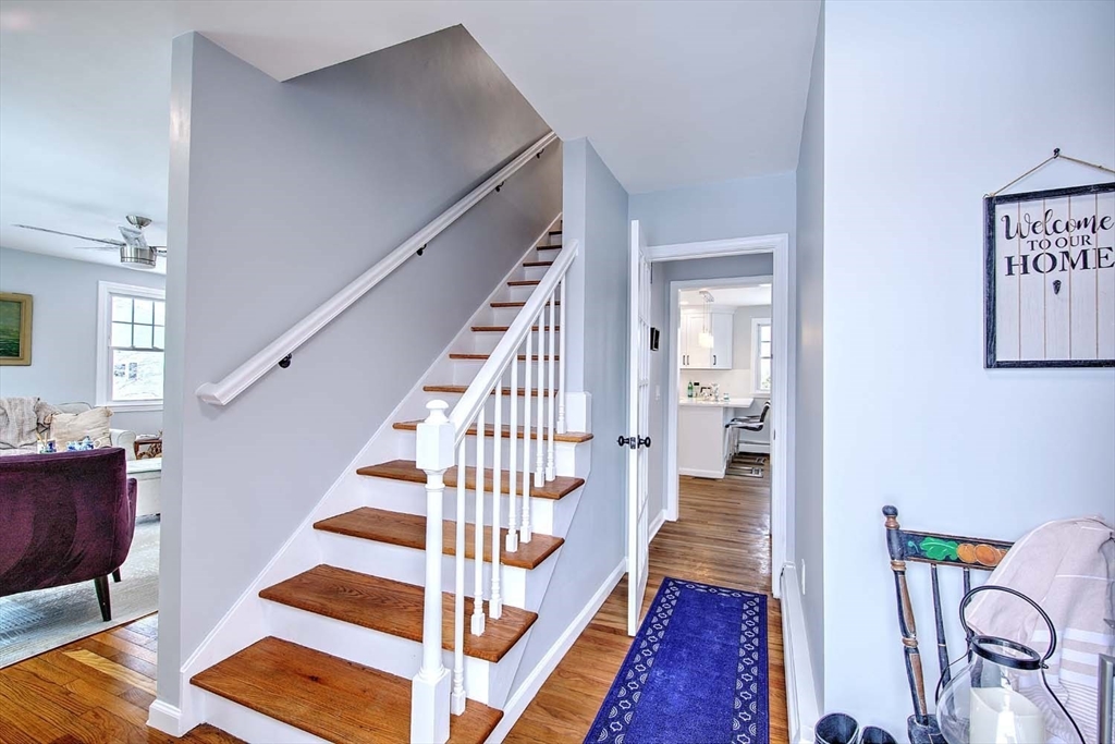 3 Pinetop Road Barrington, RI 02806 - Photo 6 of 38 a view of entryway with wooden floor and stairs