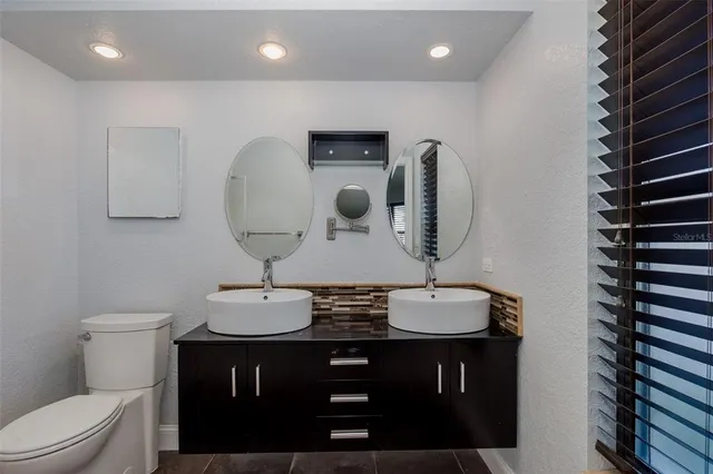 a bathroom with a white toilet