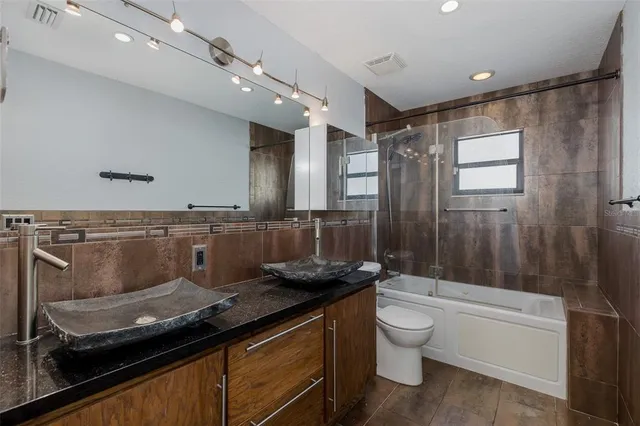 an empty room with fan and a ceiling fan