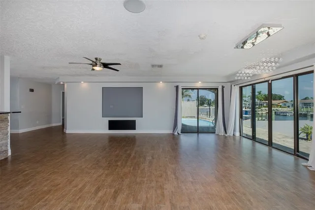 a view of a kitchen with a sink and a fireplace