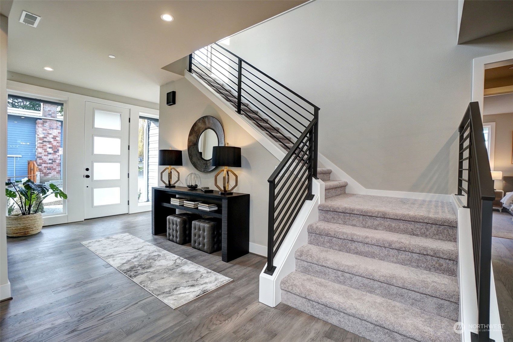 18146 94th Avenue Northeast Bothell, WA 98011 - Photo 11 of 37 a view of entryway and hall with wooden floor