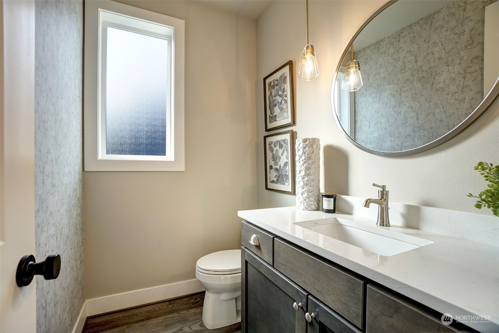 18146 94th Avenue Northeast Bothell, WA 98011 - Photo 13 of 37 a bathroom with a toilet a sink and mirror