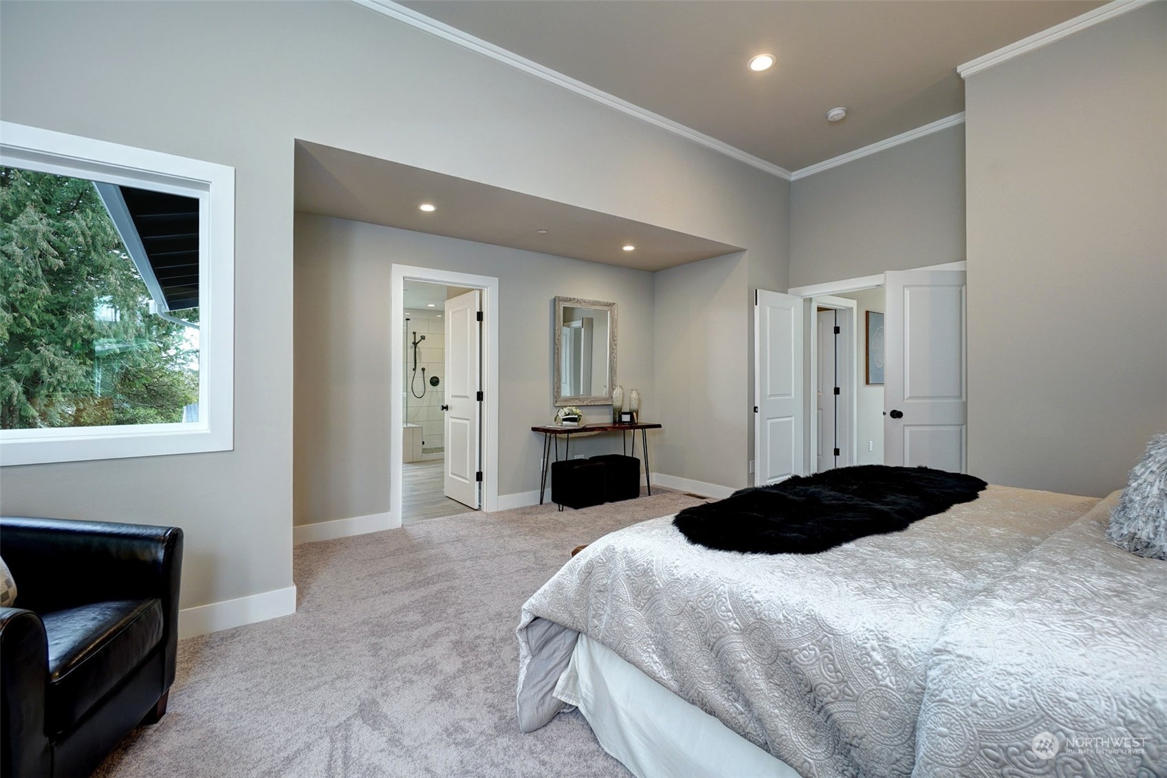 18146 94th Avenue Northeast Bothell, WA 98011 - Photo 28 of 37 a bedroom with a bed and a fireplace