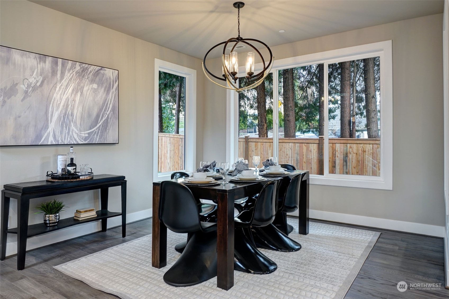 18146 94th Avenue Northeast Bothell, WA 98011 - Photo 3 of 37 a view of a dining room with furniture window and wooden floor