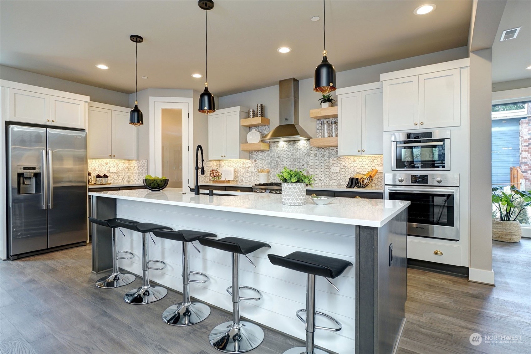 18146 94th Avenue Northeast Bothell, WA 98011 - Photo 5 of 37 a kitchen with stainless steel appliances kitchen island a refrigerator and a stove