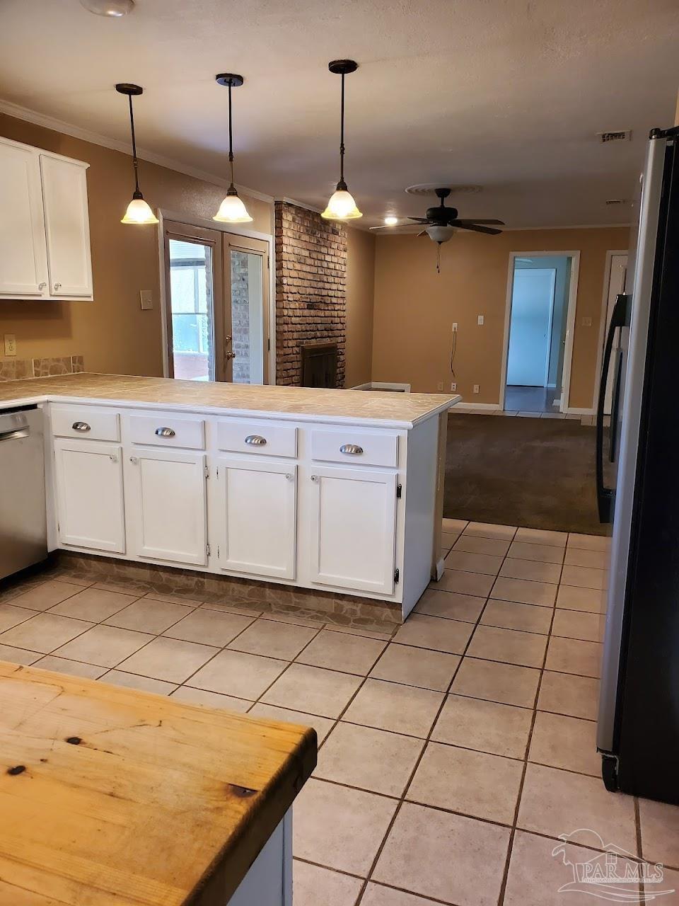 233 Cherokee Trail Pensacola, FL 32506 - Photo 11 of 36 a kitchen with stainless steel appliances granite countertop a sink a counter top space cabinets and a window