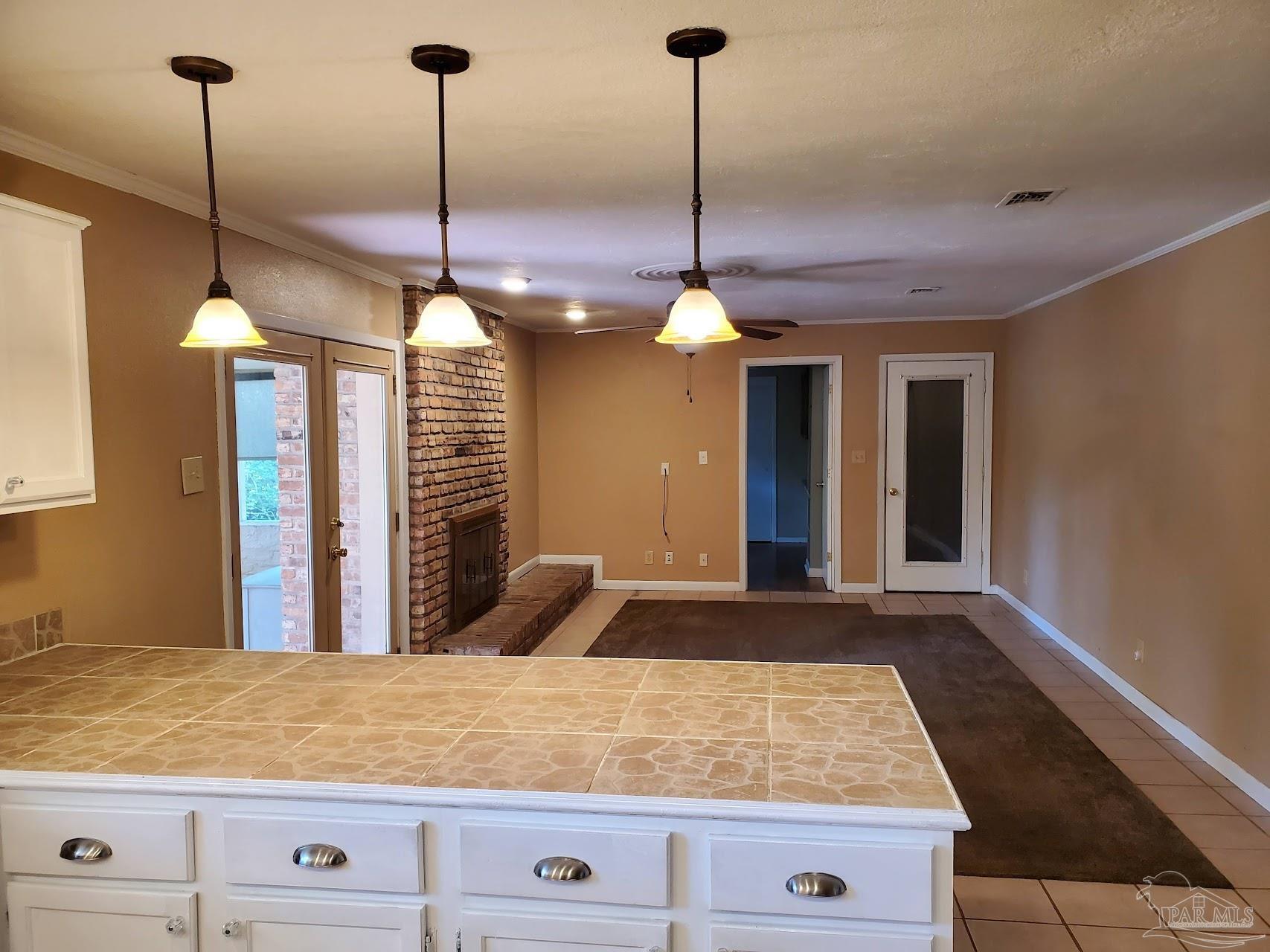 233 Cherokee Trail Pensacola, FL 32506 - Photo 12 of 36 a view of an entryway with chandelier
