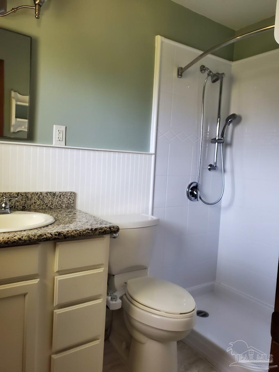 233 Cherokee Trail Pensacola, FL 32506 - Photo 26 of 36 a bathroom with a granite countertop sink toilet and shower