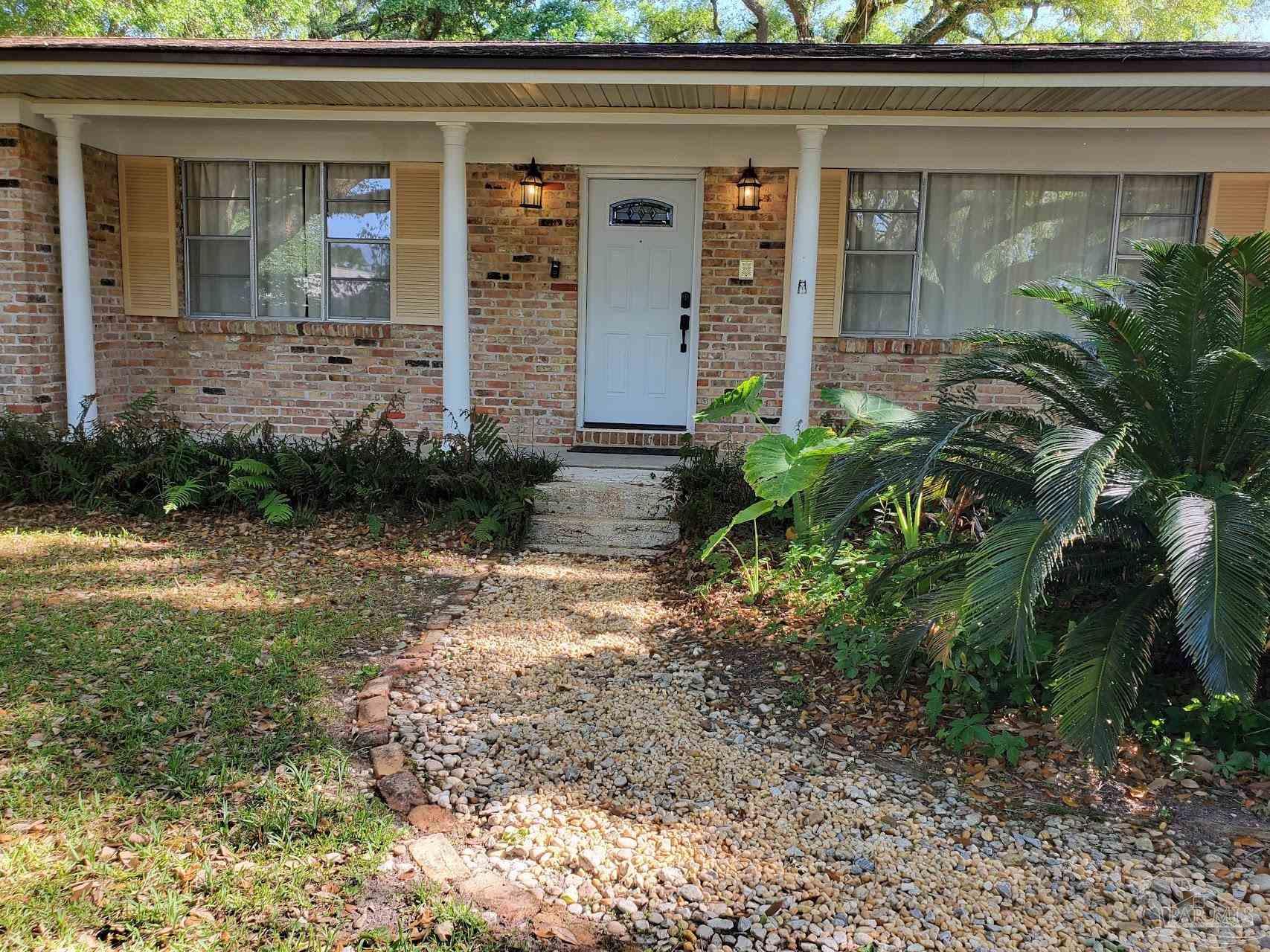 233 Cherokee Trail Pensacola, FL 32506 - Photo 36 of 36 a front view of a house with garden
