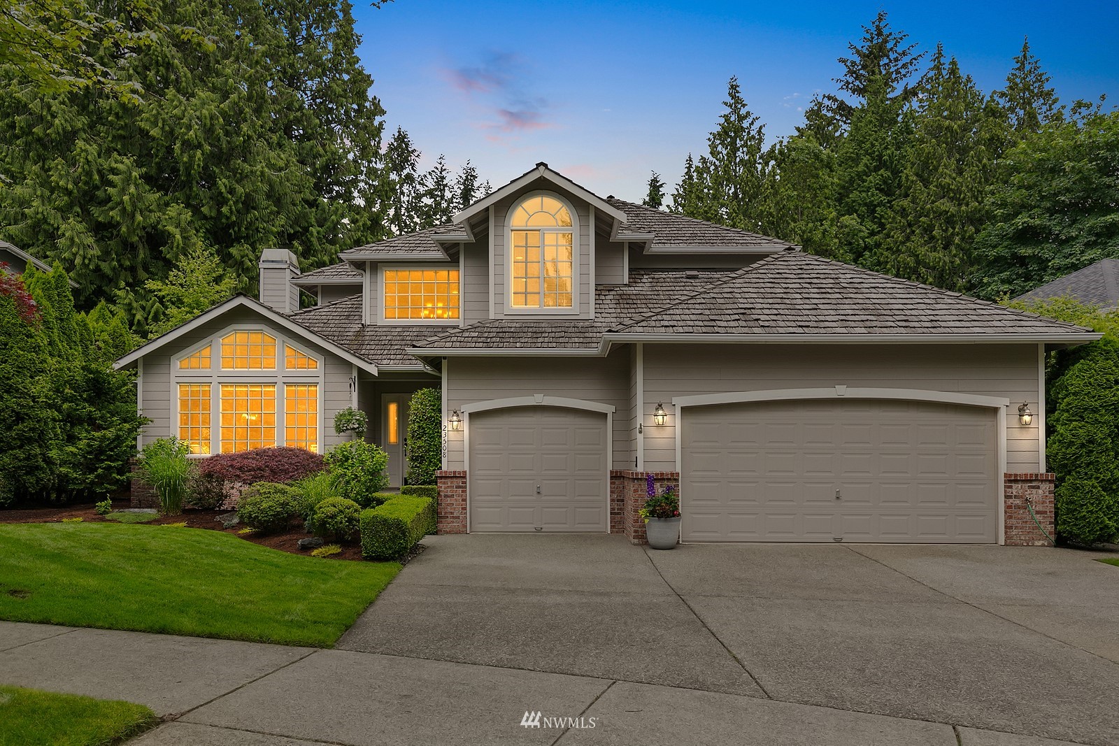 23508 25th Drive Southeast Bothell, WA 98021 - Photo 2 of 39 a front view of a house with a yard and garage