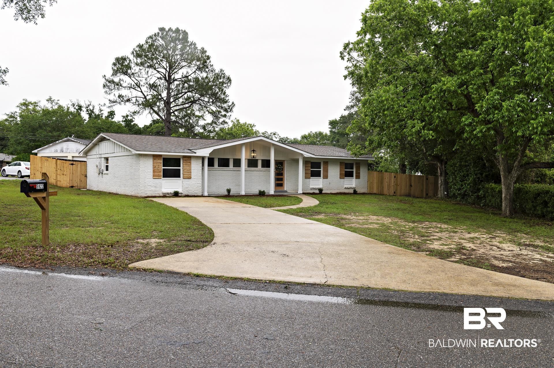 5922 Sunnyside Drive Mobile, AL 36619 - Photo 48 of 51 Ranch-style house featuring concrete driveway, brick siding, and board and batten siding