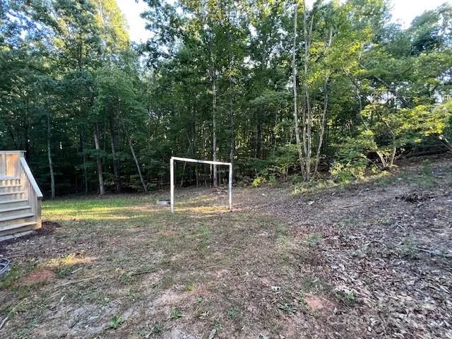 a backyard of a house with trampoline
