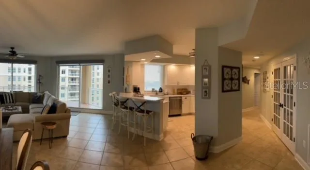 a bedroom with a large bed and a flat screen tv