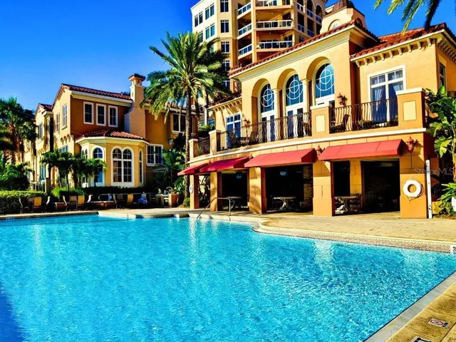 an outdoor living area with furniture and a fireplace