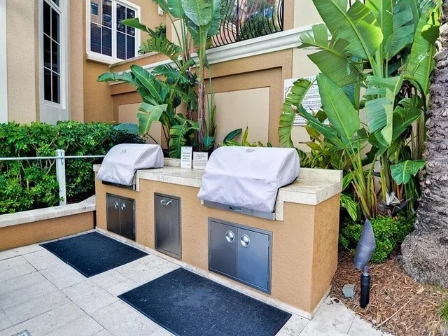 a picture of houses with palm trees