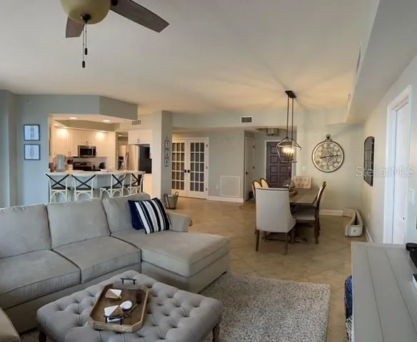 a view of a chairs and table in patio with a lake view
