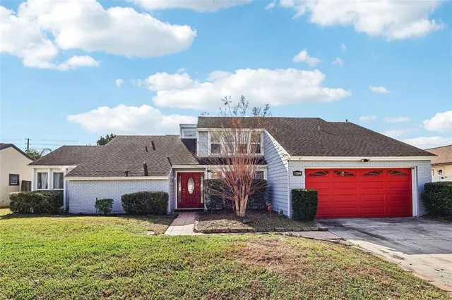 a view of a house with a yard