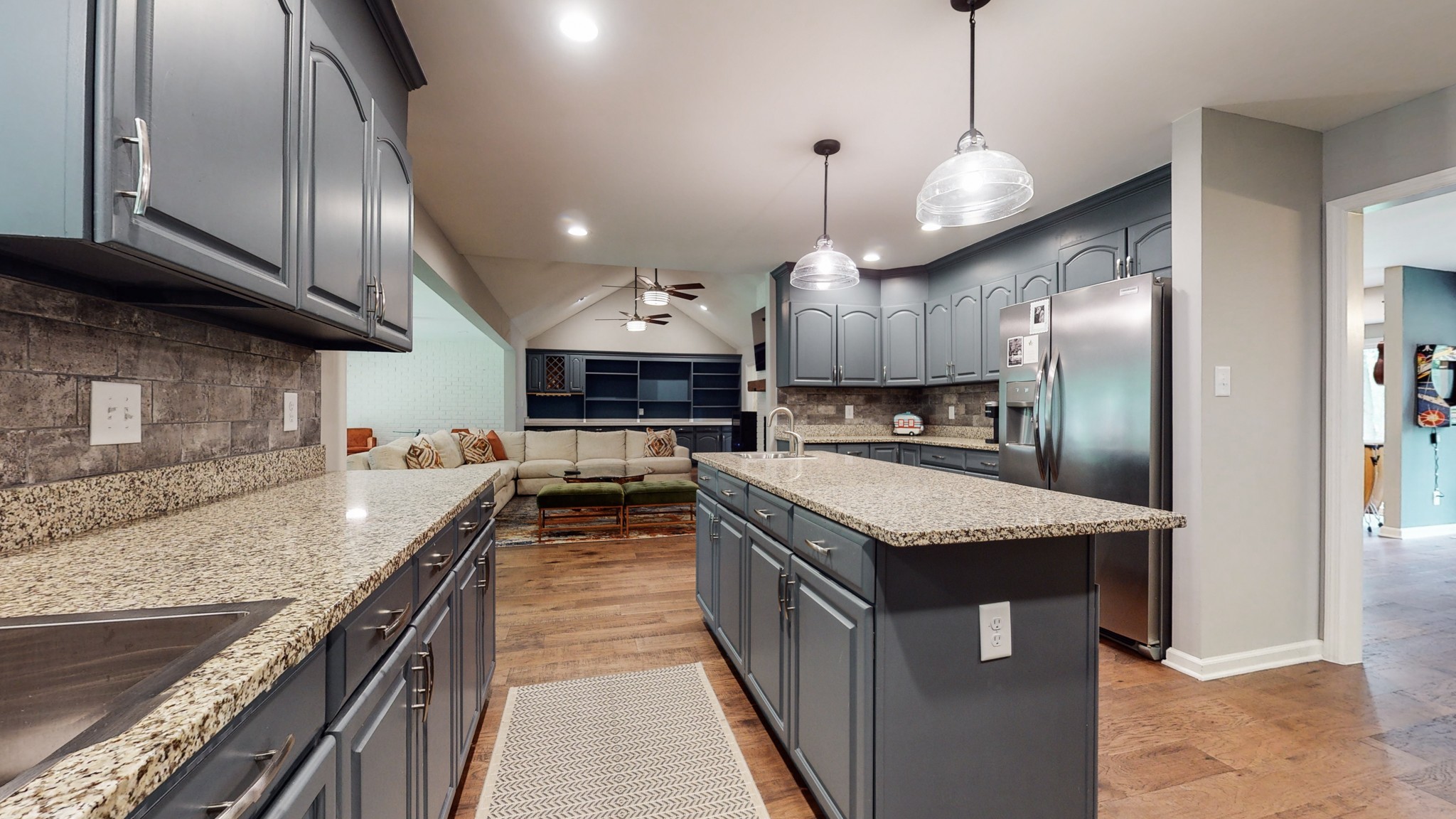 608 Cooks Hill Road Mount Juliet, TN 37122 - Photo 14 of 48 a kitchen with stainless steel appliances granite countertop wooden cabinets a sink a stove and a wooden floors