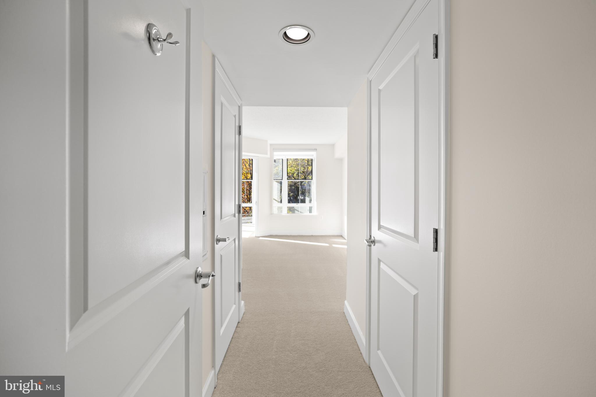 11800 Sunset Hills Road, Unit 611 Reston, VA 20190 - Photo 20 of 40 a view of a hallway with a dining room