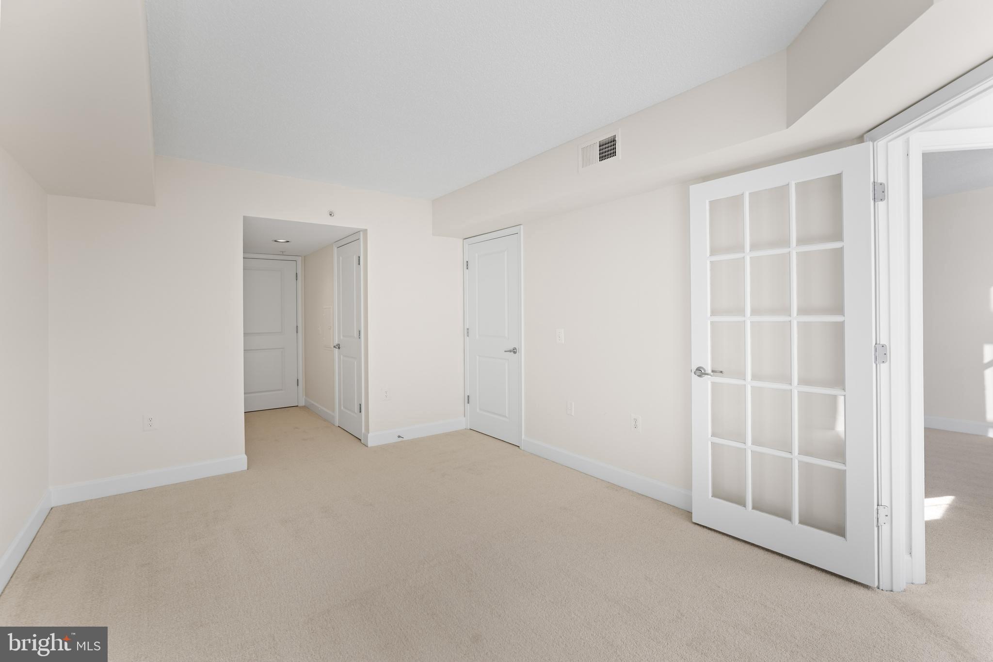 11800 Sunset Hills Road, Unit 611 Reston, VA 20190 - Photo 22 of 40 an empty room with windows