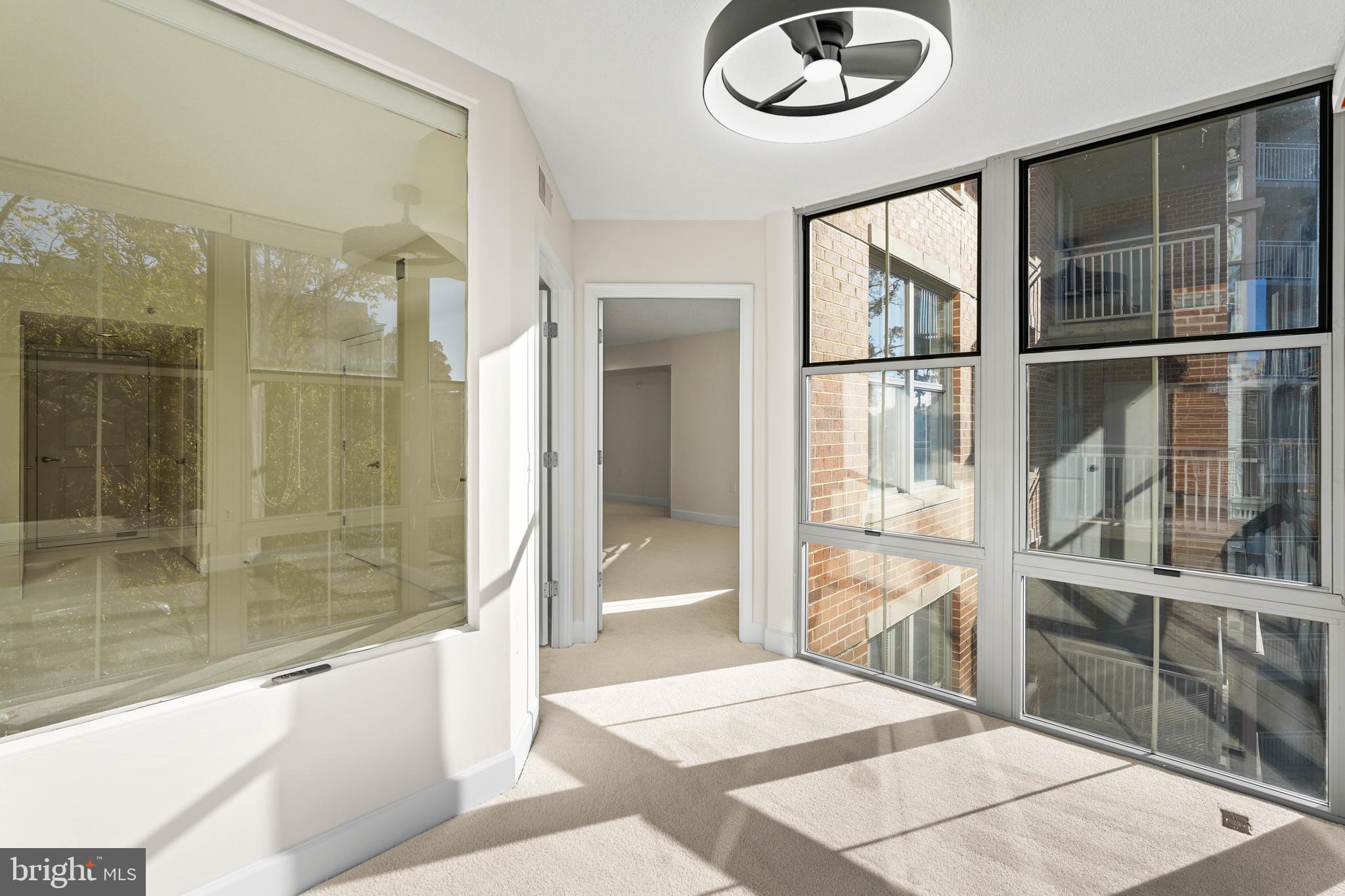 11800 Sunset Hills Road, Unit 611 Reston, VA 20190 - Photo 24 of 40 a bathroom with a glass shower door and a window