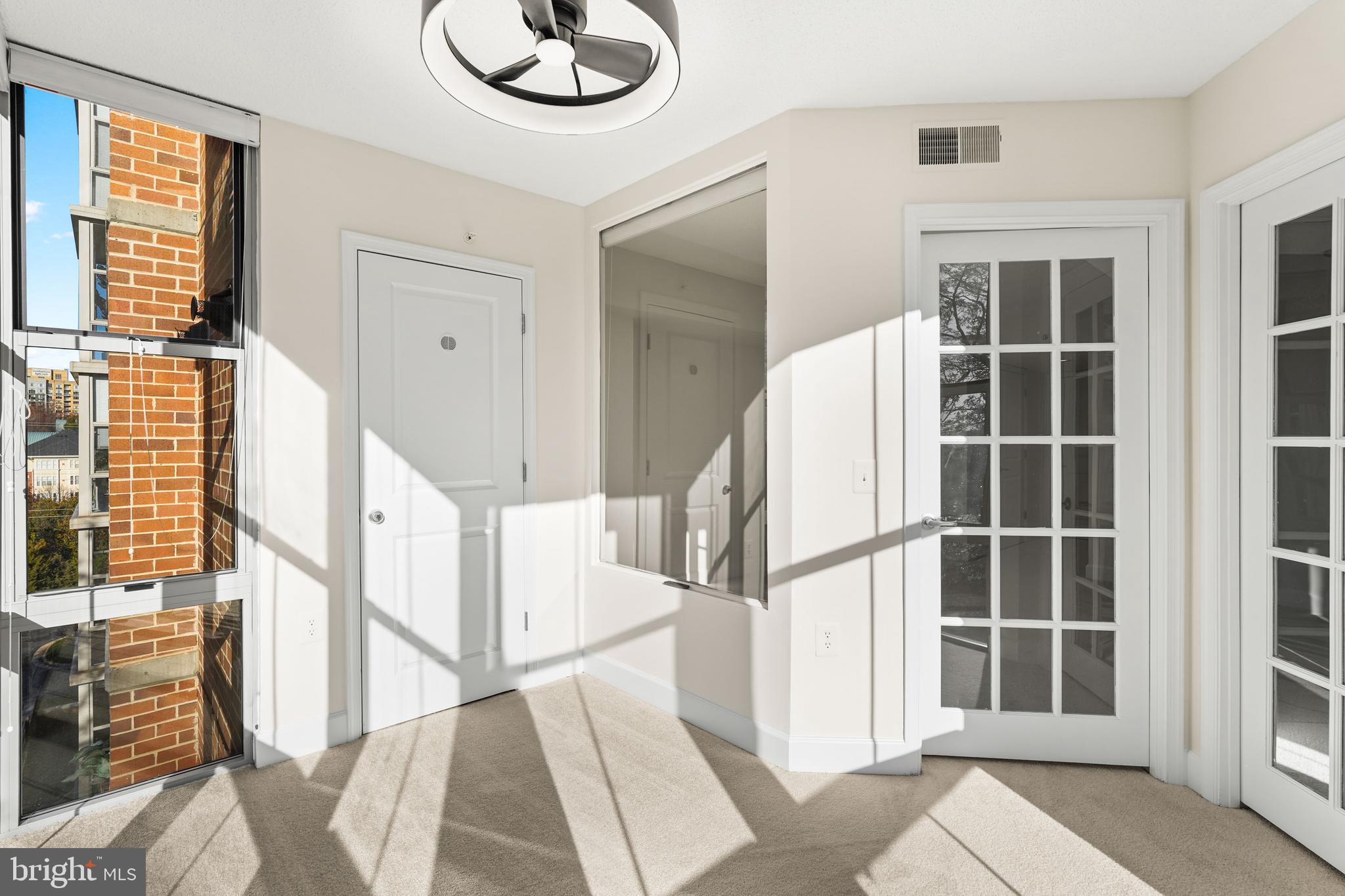 11800 Sunset Hills Road, Unit 611 Reston, VA 20190 - Photo 25 of 40 a view of staircase with white walls and windows