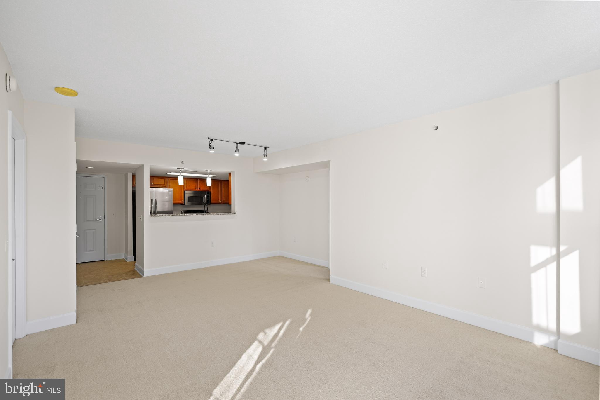 11800 Sunset Hills Road, Unit 611 Reston, VA 20190 - Photo 26 of 40 an empty room with windows