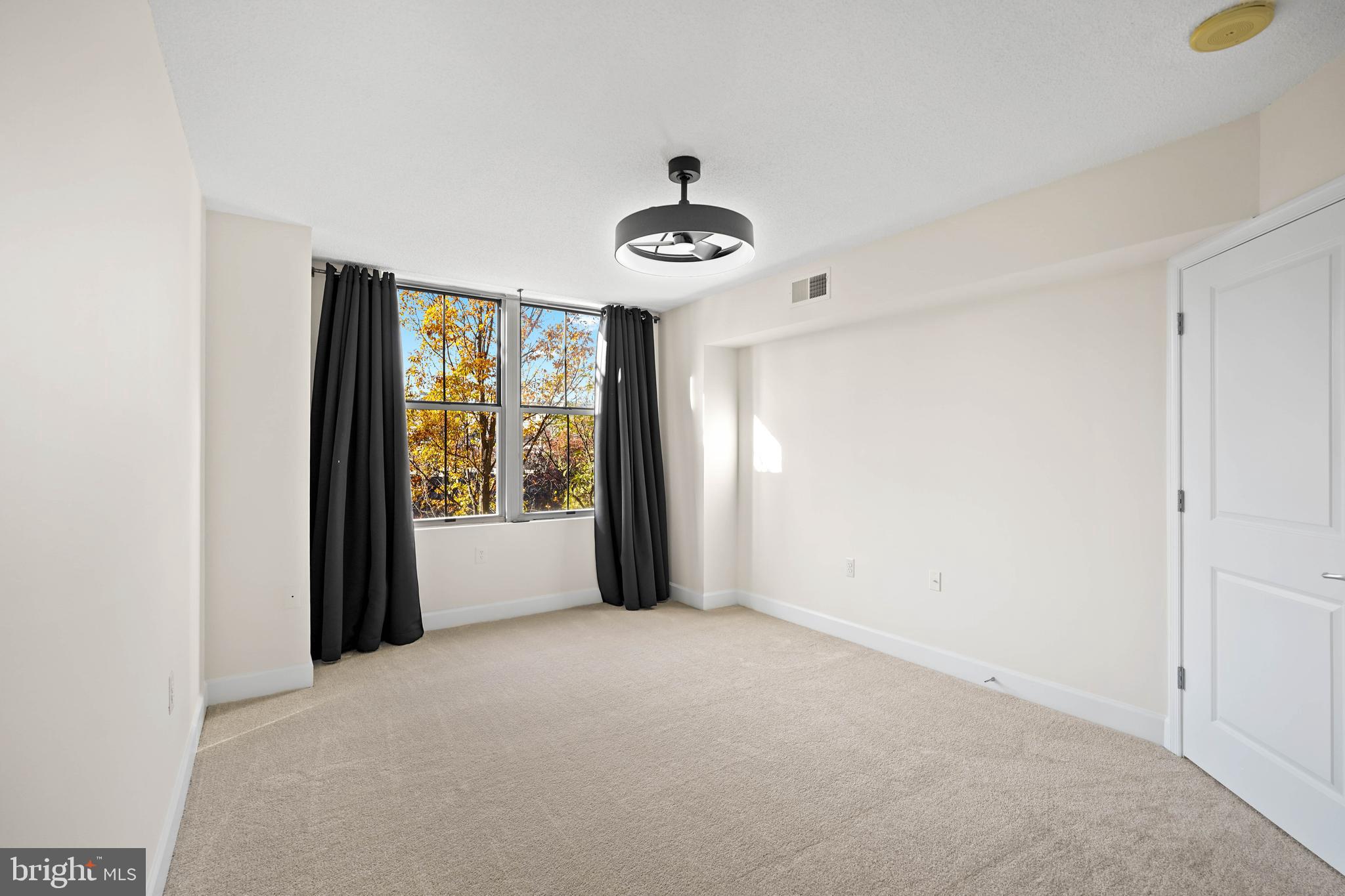 11800 Sunset Hills Road, Unit 611 Reston, VA 20190 - Photo 31 of 40 a view of an empty room with a window