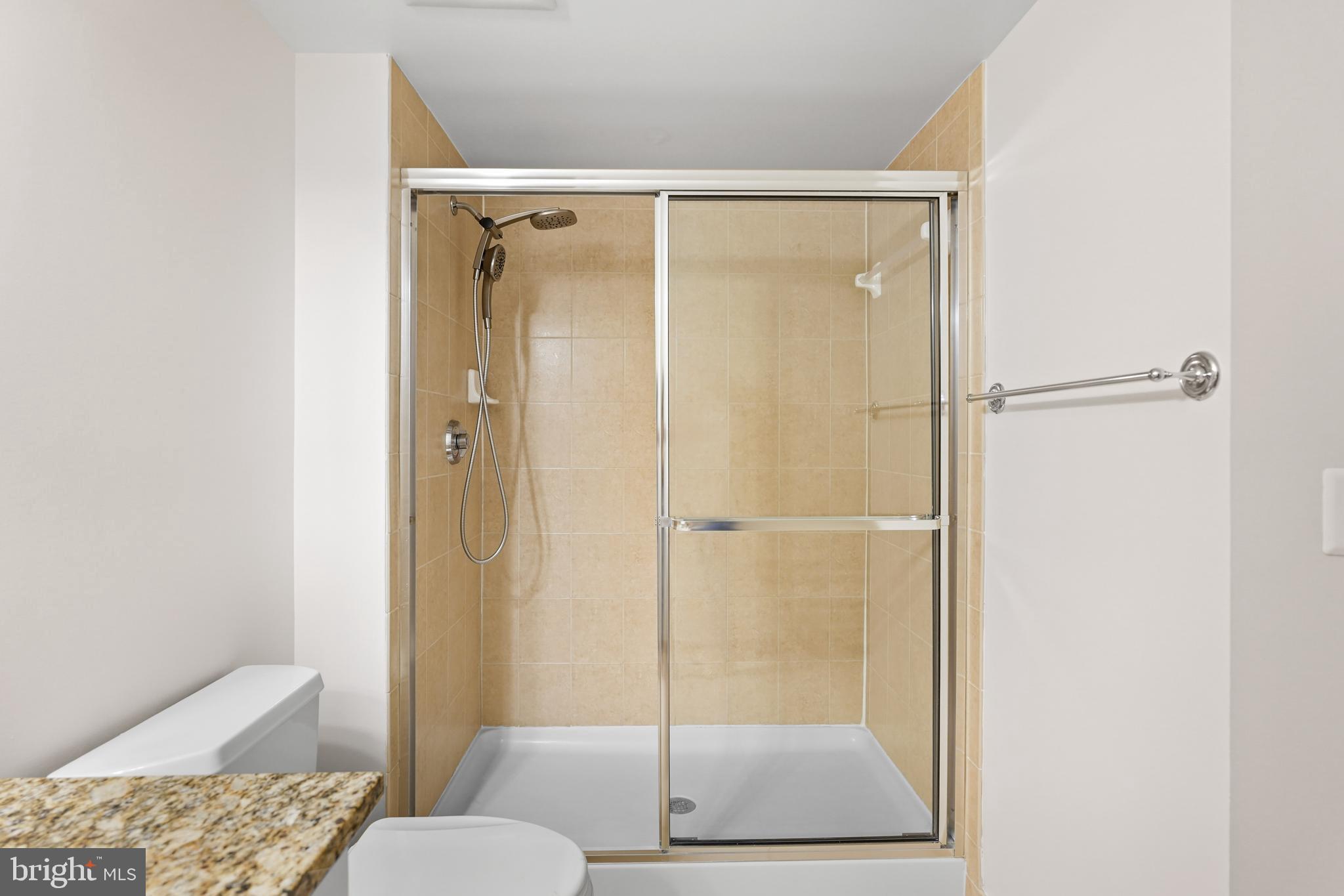 11800 Sunset Hills Road, Unit 611 Reston, VA 20190 - Photo 34 of 40 a bathroom with a shower