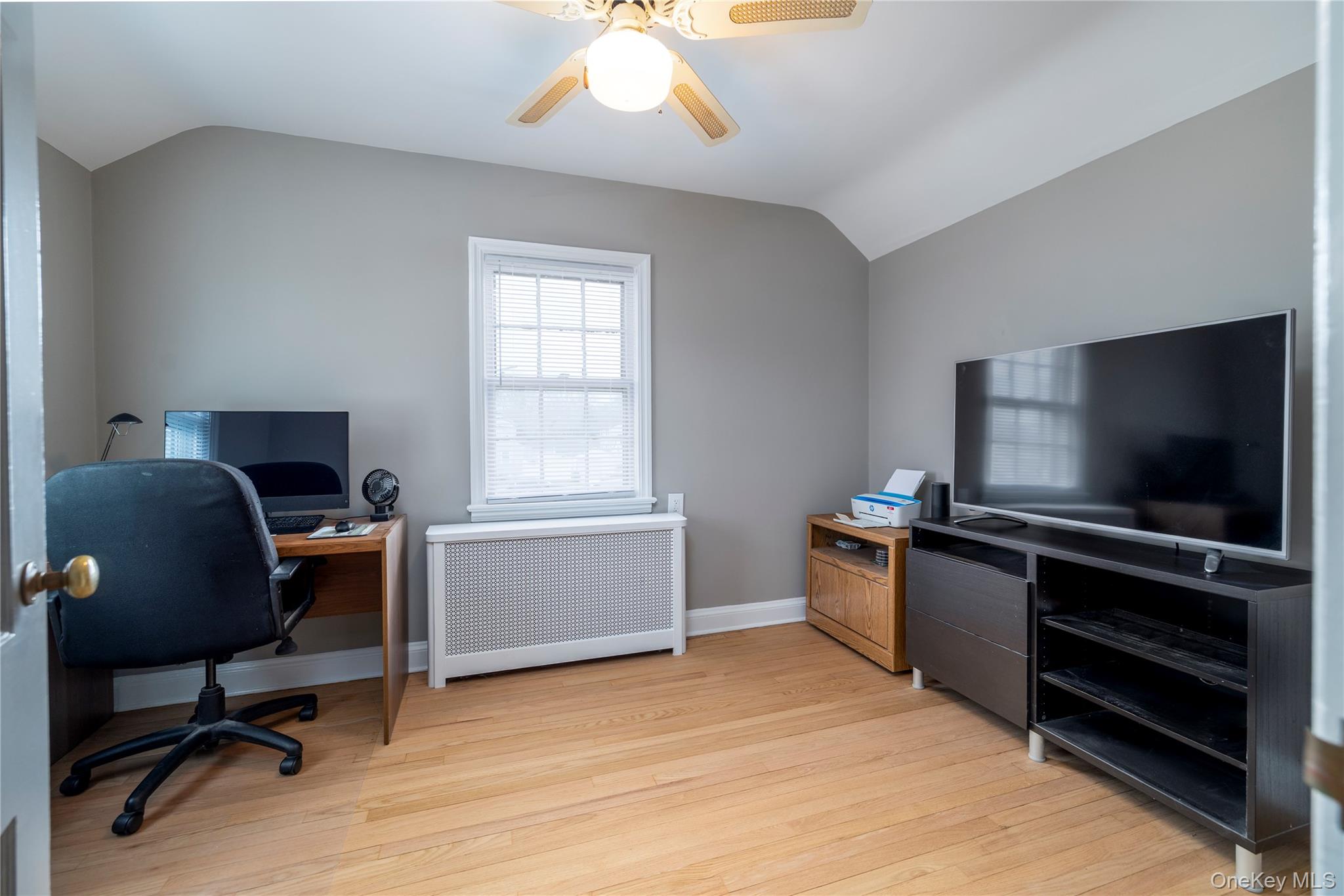 135 Chestnut Street Lynbrook, NY 11563 - Photo 14 of 18 a view of a workspace with furniture and a window