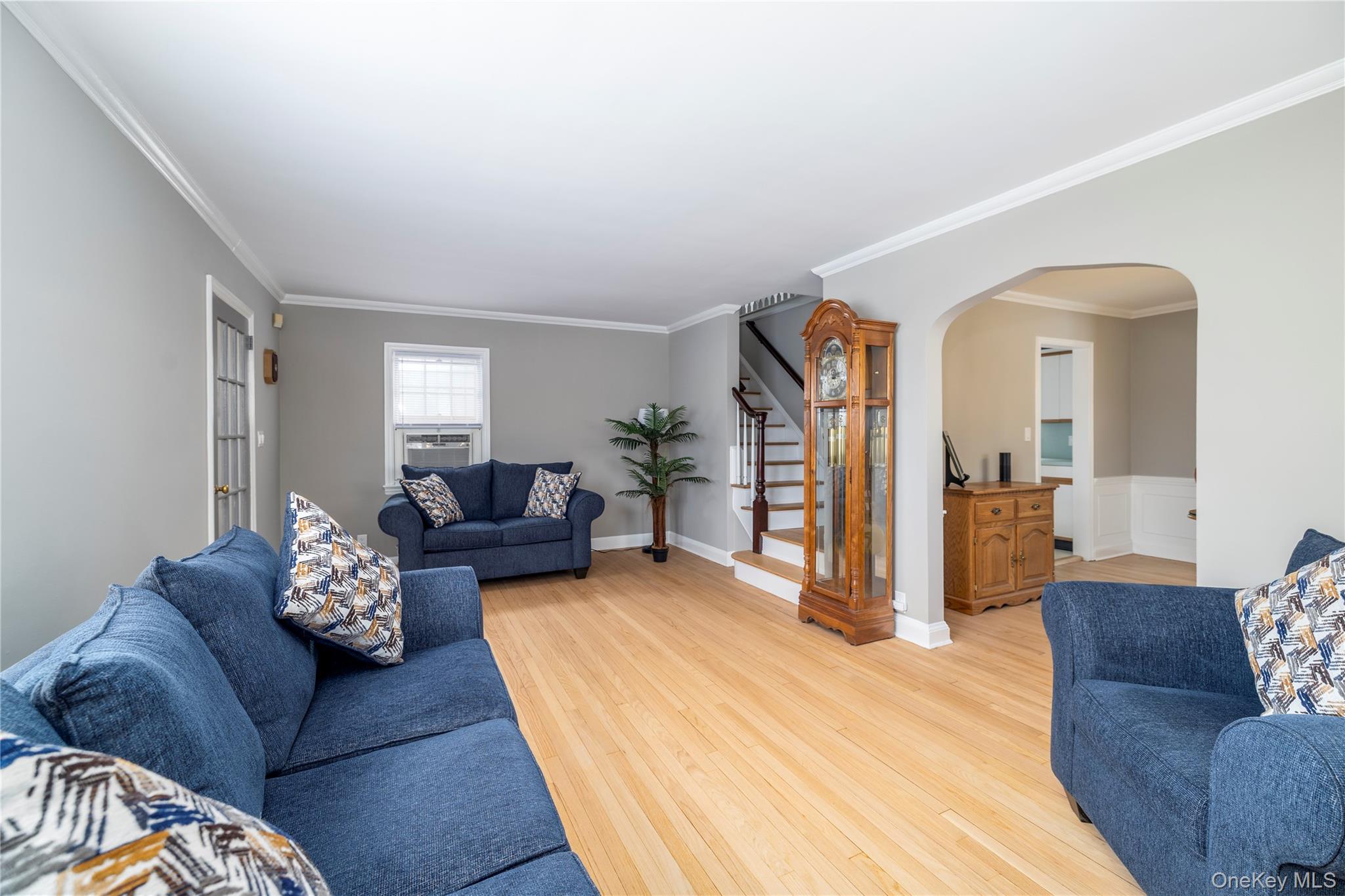135 Chestnut Street Lynbrook, NY 11563 - Photo 4 of 18 a bedroom with furniture and wooden floor