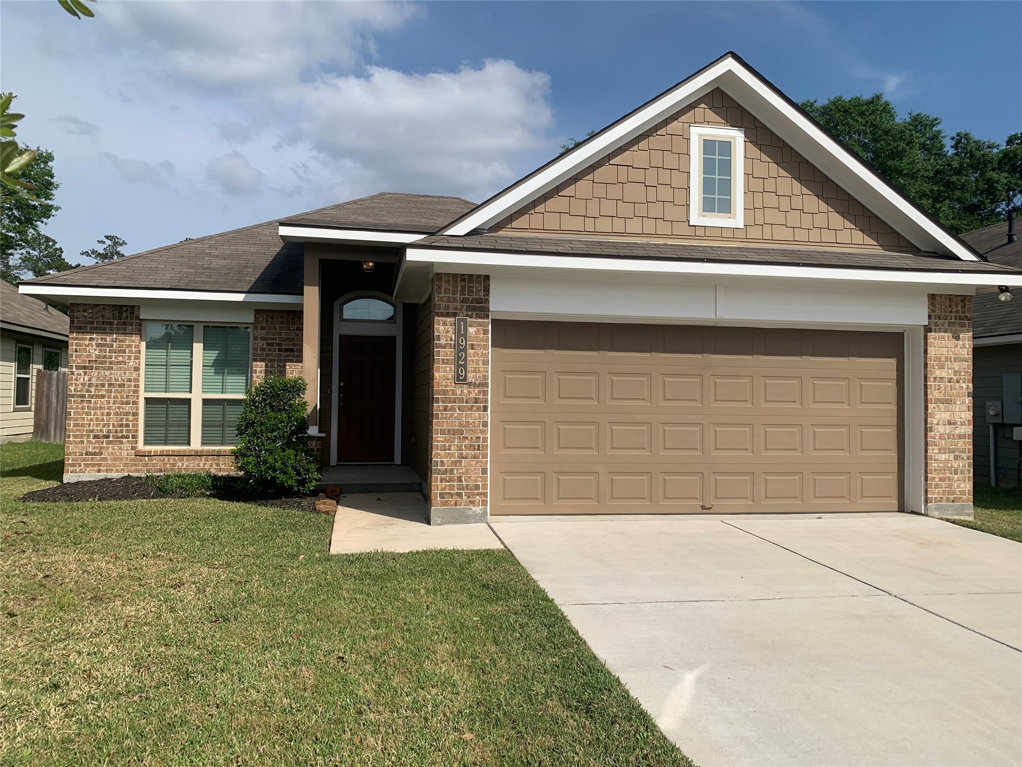 1929 Briar Grove Drive Conroe, TX 77301 - Photo 3 of 17 a front view of a house with garden