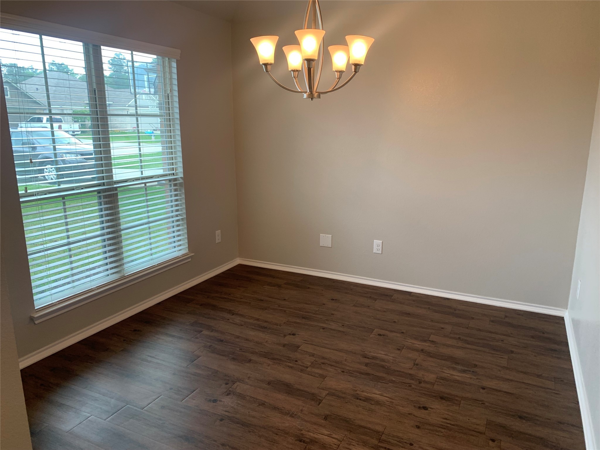 1929 Briar Grove Drive Conroe, TX 77301 - Photo 6 of 17 a view of an empty room with wooden floor and a window