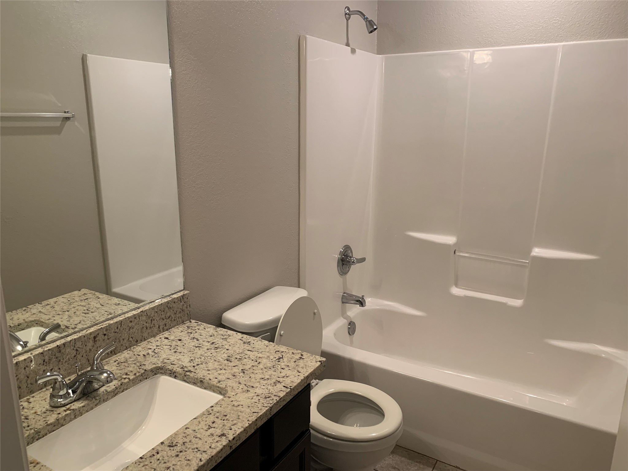 1929 Briar Grove Drive Conroe, TX 77301 - Photo 9 of 17 a bathroom with a granite countertop sink toilet and shower