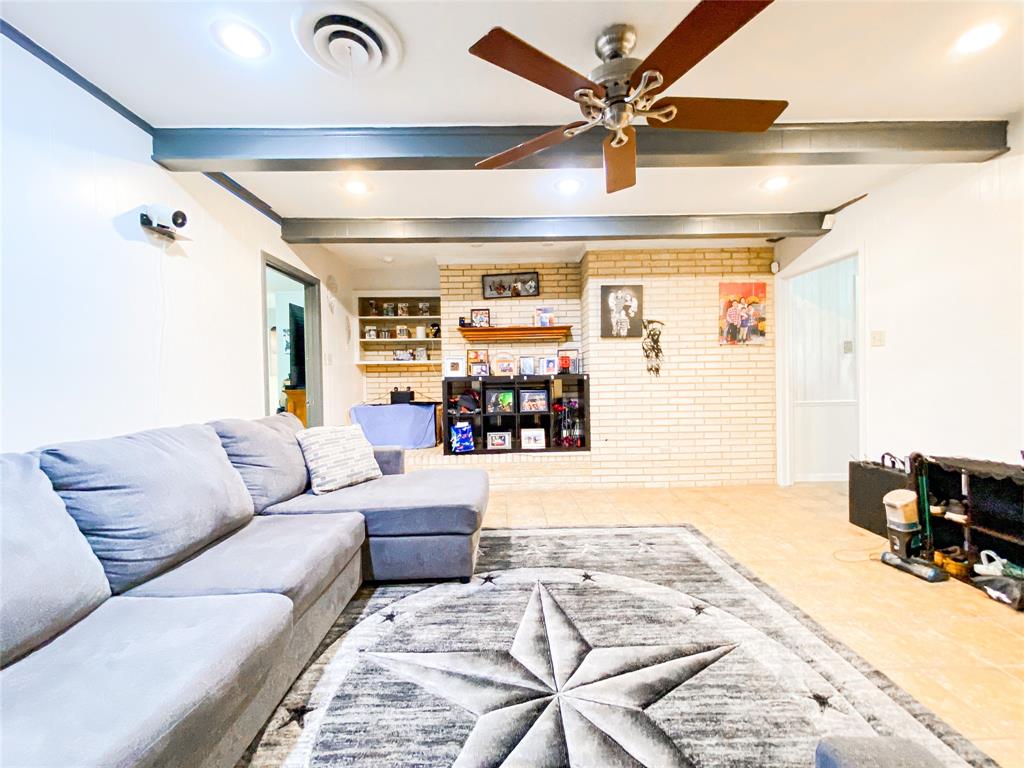 4301 Caprock Road Abilene, TX 79606 - Photo 6 of 29 Spacious living area featuring exposed ceiling beams and recessed lighting