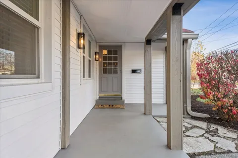 a view of a porch with seating space