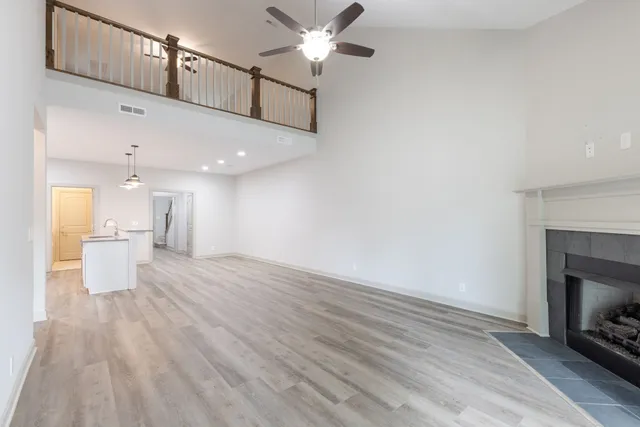 a view of a kitchen with a sink and a fireplace